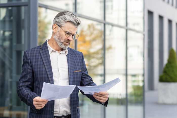 old-man-check-papers